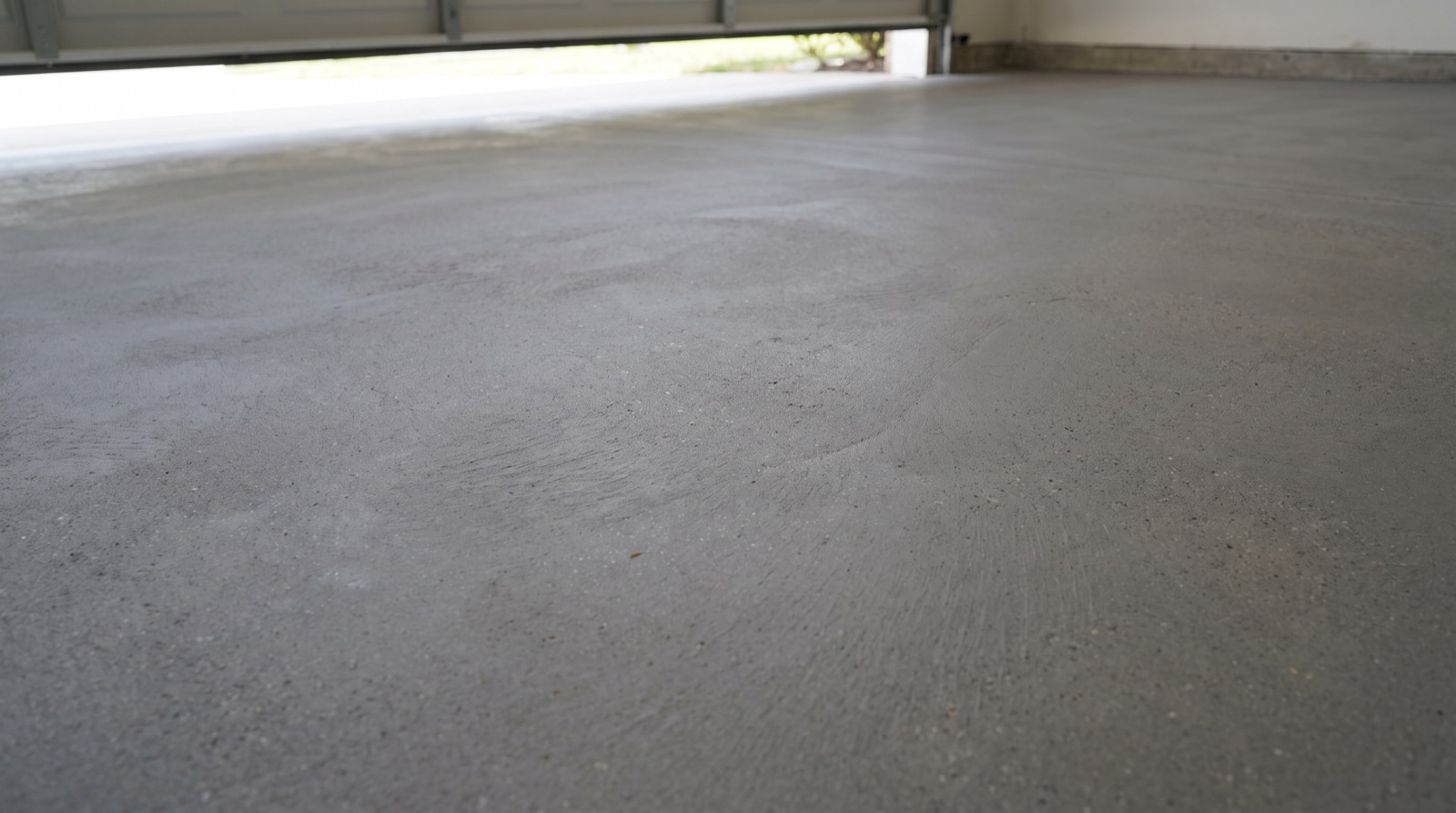 Bare, unfinished concrete garage floor
